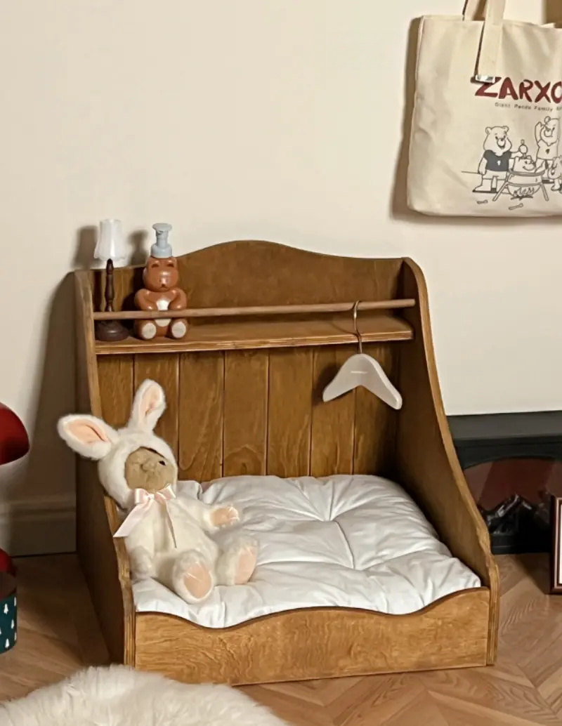 A vintage solid wood pet bed with warm furniture-grade construction